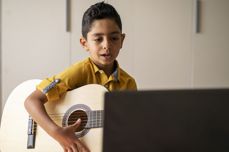 boy playing guitar